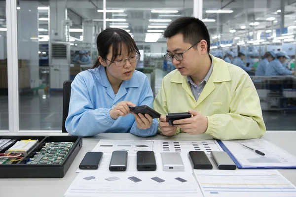 Chinese power bank factory team reviewing OEM pricing, MOQ and technical specifications