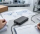 Compliance engineer reviewing a power bank against international market documents and test data
