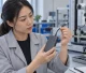 Quality engineer inspecting the built-in USB-C cable and strain relief of a power bank