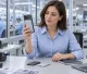 Buyer reviewing a magnetic power bank sample at an electronics supplier workstation