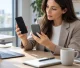 Concept office scene of a buyer examining an unbranded smartphone and magnetic power bank.