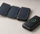 Concept illustration of a fold-out solar power bank and a smartphone resting on a wireless charging power bank.
